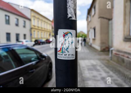 JUETERBOG, GERMANY - MAY 23, 2021: Sticker on the pole 'Stick of it all' Stock Photo