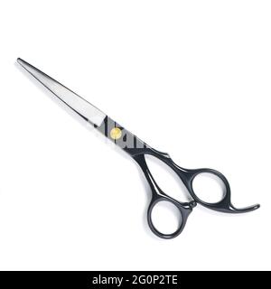 professional hairdresser black scissors isolated on white. Black barber scissors, close up. Stock Photo