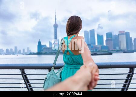 Follow me couple girlfriend travelling in Shanghai Stock Photo