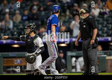 Home plate umpire Marvin Hudson warns New York Yankees manager Joe