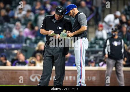 Home plate umpire Marvin Hudson warns New York Yankees manager Joe