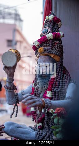 Haridwar, Uttarakhand, India April 12, 2021. Indian Saints in their traditional way of Yog Mudra, meditating. Sitting in silence as part of the initiation of new sadhus during Kumbha Mela. The Naga Sadhus.  Stock Photo