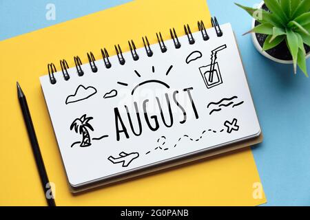 Summer month august drawn on a notebook. Stock Photo