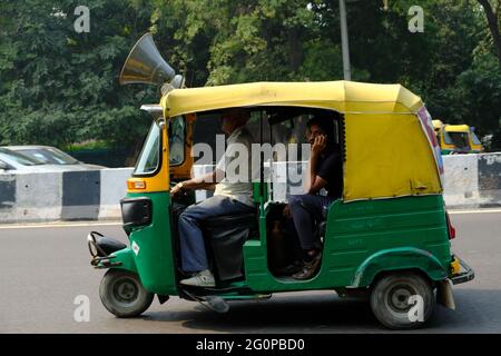 India Delhi - Driving Auto rickshaw Stock Photo