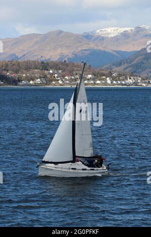 Lively Lady (B30), a privately-owned Bavaria 30 Cruiser yacht, passing Gourock on the Firth of Clyde. Stock Photo