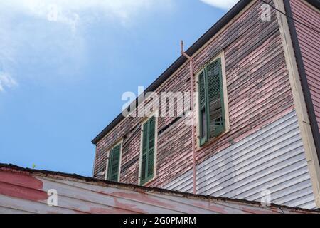 Side of Old House Showing Wear and Disrepair Stock Photo