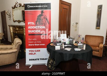 Long Beach, California, USA. 26th May, 2021. The American Soldier Network, a nonprofit that helps veterans, set up a in the VIP Room at the First Annual 'Run for the Rite' Festival and 'A Night of Southern Rock' concert event to benefit veterans on Memorial Day weekend at the Long Beach Scottish Rite Cultural Centre in Long Beach, California.  Credit: Sheri Determan Stock Photo