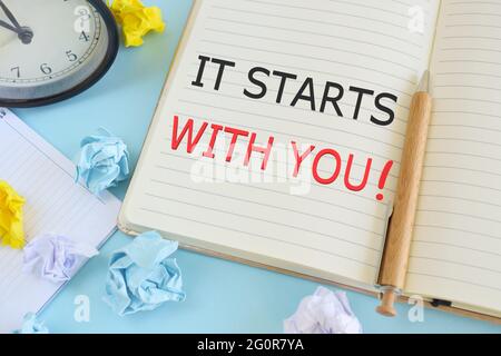 Handwriting text It Starts With You. Concept meaning Motivation for starting doing something Have discipline. Stock Photo