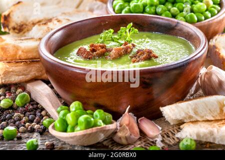 Potage soup made from fresh domestic peas with spices Stock Photo