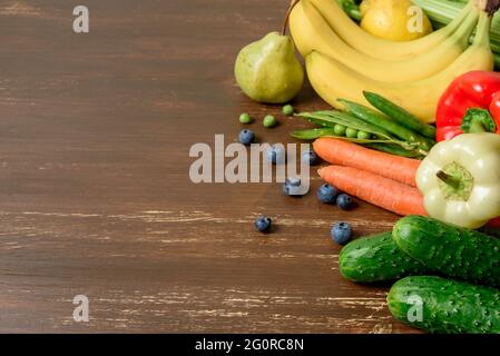 Local grow organic Vegetables and fruits on wooden table Stock Photo
