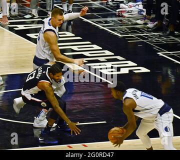 Los Angeles, United States. 03rd June, 2021. Los Angeles Clippers guard Paul George (13) loses control of the ball to Dallas Mavericks forward Dorian Finney-Smith (10) during the fourth quarter in Game 5 of their best-of-seven playoff series at Staples Center in Los Angeles on Wednesday, June 2, 2021. The Clippers lost to Dallas 105-100, their championship ambitions are hanging on for dear life trailing 3-2 in the series, with Game 6 coming on Friday in Dallas. Photo by Jim Ruymen/UPI Credit: UPI/Alamy Live News Stock Photo