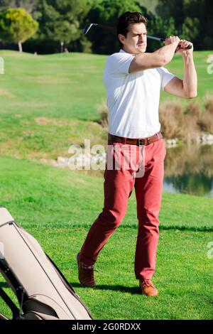 Glad man golfer propelled ball successfully Stock Photo