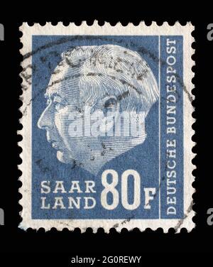 Stamp from Germany area Saar shows portrait of Theodor Heuss (1884-1963), first President of the Federal Republic of Germany, circa 1957 Stock Photo