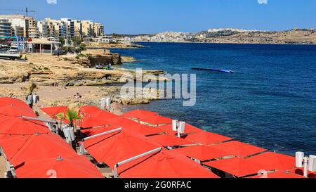 Sun shades on the beach at Bugibba. Malta. Stock Photo