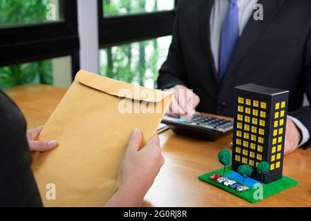 Homeowner brought the documents to the bank for check and submitted to refinance room in condominium, Mortgage house loan and real estate property inv Stock Photo