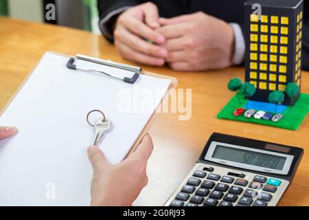 Homeowner brought the documents to the bank for check and submitted to refinance room in condominium, Mortgage house loan and real estate property inv Stock Photo