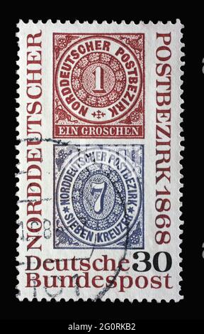 Stamp printed in Germany showing two historical stamps from 1868, North German Postal Confederation, circa 1968 Stock Photo