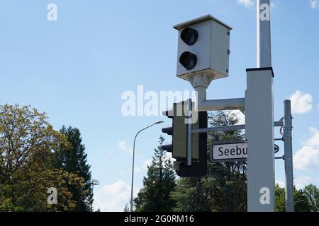 Speed camera mounted on a pole for monitoring a road. Stock Photo