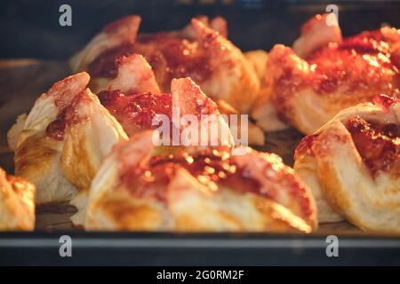 Plum puff pastry from Finland joulutorttu in the oven, after cooking Stock Photo