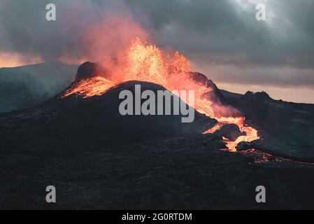 MAY 2021: The broader Fagradalsfjall volcanic system comprises an area of eruptive fissures (fissure swarm), cones and lava fields in the southern part of the Reykjanes peninsula. A strong seismic crisis began in the area near Fagradalsfjall since late Feb 2021, interpreted as intrusion of magma at shallow depth. This led to the first historic eruption of the volcano on 19 March 2021. Stock Photo