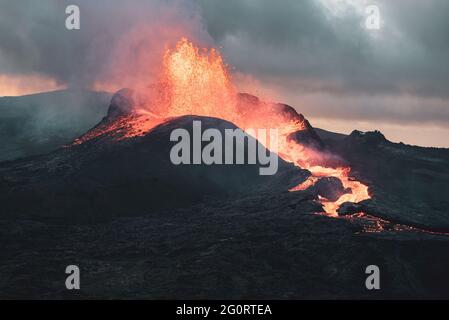 MAY 2021: The broader Fagradalsfjall volcanic system comprises an area of eruptive fissures (fissure swarm), cones and lava fields in the southern part of the Reykjanes peninsula. A strong seismic crisis began in the area near Fagradalsfjall since late Feb 2021, interpreted as intrusion of magma at shallow depth. This led to the first historic eruption of the volcano on 19 March 2021. Stock Photo