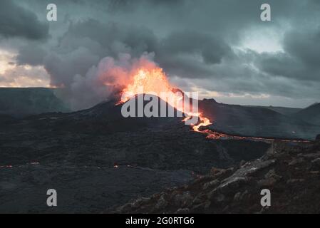 MAY 2021: The broader Fagradalsfjall volcanic system comprises an area of eruptive fissures (fissure swarm), cones and lava fields in the southern part of the Reykjanes peninsula. A strong seismic crisis began in the area near Fagradalsfjall since late Feb 2021, interpreted as intrusion of magma at shallow depth. This led to the first historic eruption of the volcano on 19 March 2021. Stock Photo