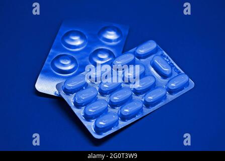 Blister packs of pills on blue tones Stock Photo