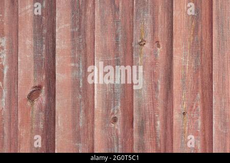Surface of the old wall sheathed with wooden boards, wooden background, texture Stock Photo