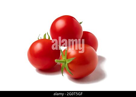 Several ripe whole cherry tomatoes isolated on white background Stock Photo