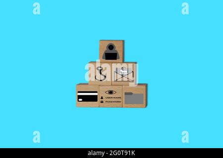 A pyramid of wooden cubes with symbols imprinted on them, symbolizing phishing and hacking means and target assets. Stock Photo
