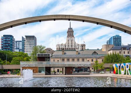 Canada Life Building framed in the Peace Arches in Nathan Phillips Square in the downtown district of Toronto city, Canada Stock Photo