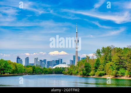 The Toronto city skyline during the daytime and seen from the Lake Ontario, Canada. The image includes the CN Tower which is a symbol of the country Stock Photo