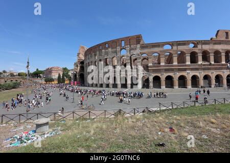 Tourists at the Colosseum, or Coliseum, in the center of Rome, Italy. It is the largest amphitheater ever built Stock Photo