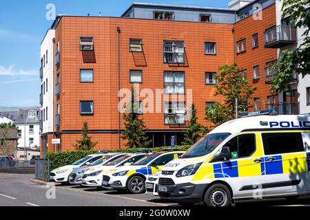 Epsom Surrey London UK, June 03 2021, A Row Of Police Cars Parked In Front Of A Modern Development Of High Rise Apartments With NOoPeople Stock Photo