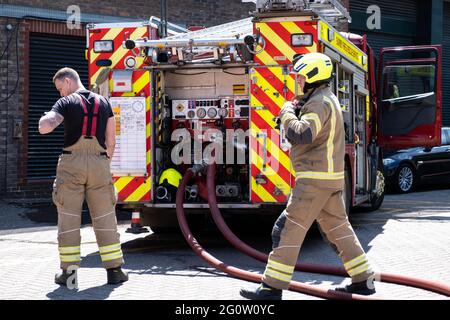 Epsom Surrey London UK, June 03 2021, Fire Truck And Fire Fighters Attending A Fire In A Public Car Park Stock Photo