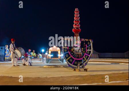 Thar desert, Rajasthan, India - October 15th 2019 : Female dancer dancing Bhavai, a folk dance, balancing six earthen pots on her head. Stock Photo