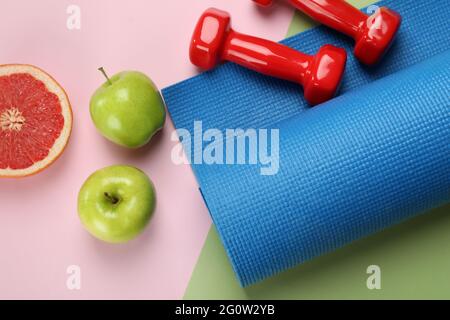 Healthy lifestyle accessories on two tone background Stock Photo