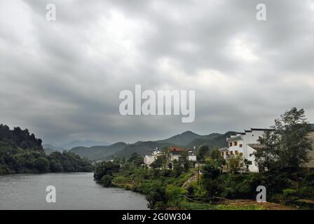 Wangkou in Wuyuan County, Jiangxi Province, China. Wangkou is an ancient town known for its Tang Dynasty architecture. Scenic view with river. Stock Photo