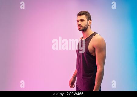 Focused bearded european young man in studio Stock Photo