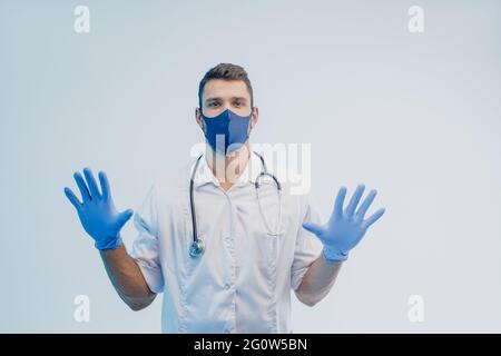 Male doctor in protective mask and latex gloves Stock Photo