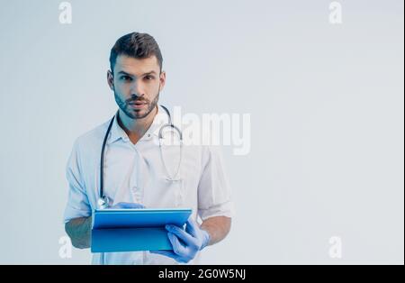 European male doctor with a digital tablet Stock Photo