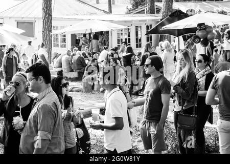 JOHANNESBURG, SOUTH AFRICA - Jan 05, 2021: Johannesburg, South Africa - May 24, 2015: Crowds of diverse people sitting in the beer garden at outdoor f Stock Photo