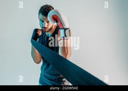 Boxer with boxing bandage and glove on hands Stock Photo