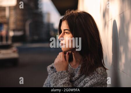 Portrait of thoughtful non-binary woman standing in city Stock Photo