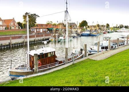 GREETSIEL, GERMANY - AUG 9, 2020: Harbour or harbor of the historic shipping town of Greetsiel, North Sea, Germany Stock Photo