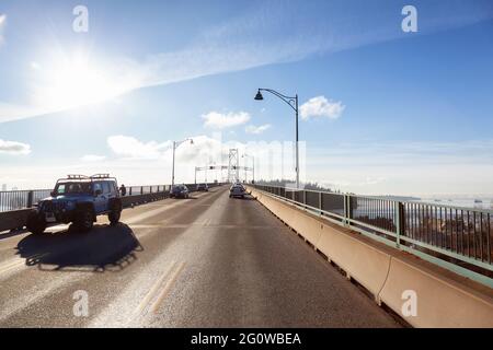 Drive across the famous Lions Gate Bridge in the modern Downtown City. Stock Photo