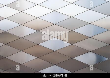 Background of multi-colored diamond-shaped metal panels, close-up Stock Photo