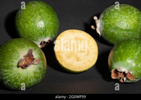 sliced feijoa on black background Stock Photo