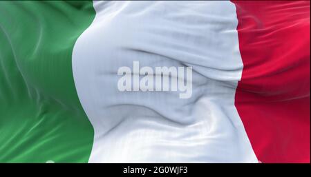 The tricolor flag of Italy waving in the wind. Italian national flag in green, white and red vertical stripes. Democracy and patriotism. Symbol of nat Stock Photo