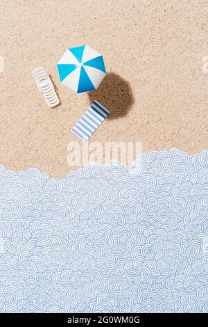 White and blue beach umbrella, sun chair and blue and white striped towel on sand and paper waves. Beach set for sunny days. Summer holiday concept. t Stock Photo